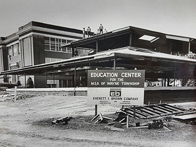 black and white image of education center under construction