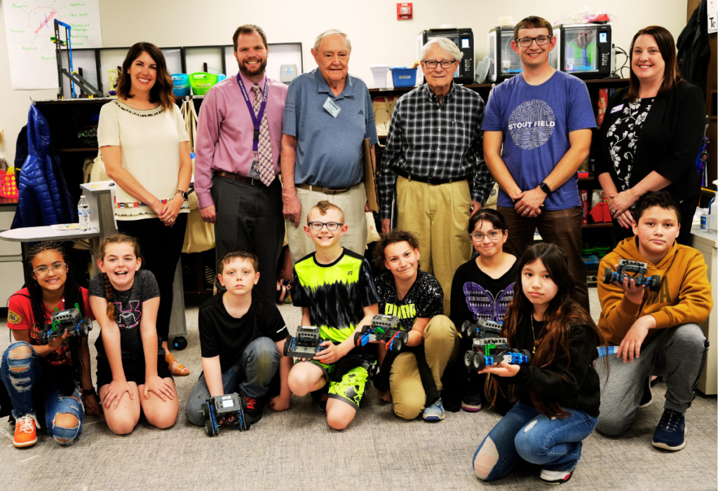 Photo of Stout Field group receiving generous Scientech grant for the robotics program